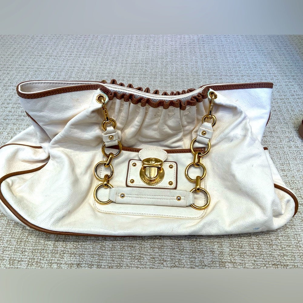 Marc Jacobs cream purse with tan piping and gold chain